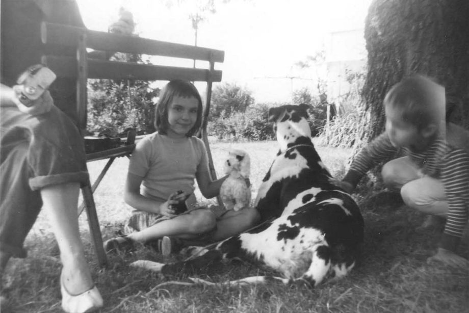 Rachael as a child with the family Great Dane