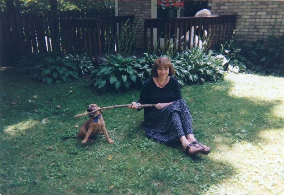 A younger Rachael holding a puppy